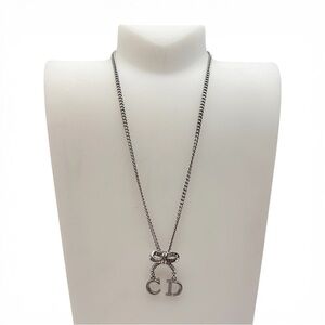Christian Dior CD Bow Pendant Necklace Silver Tone Crystal Logo